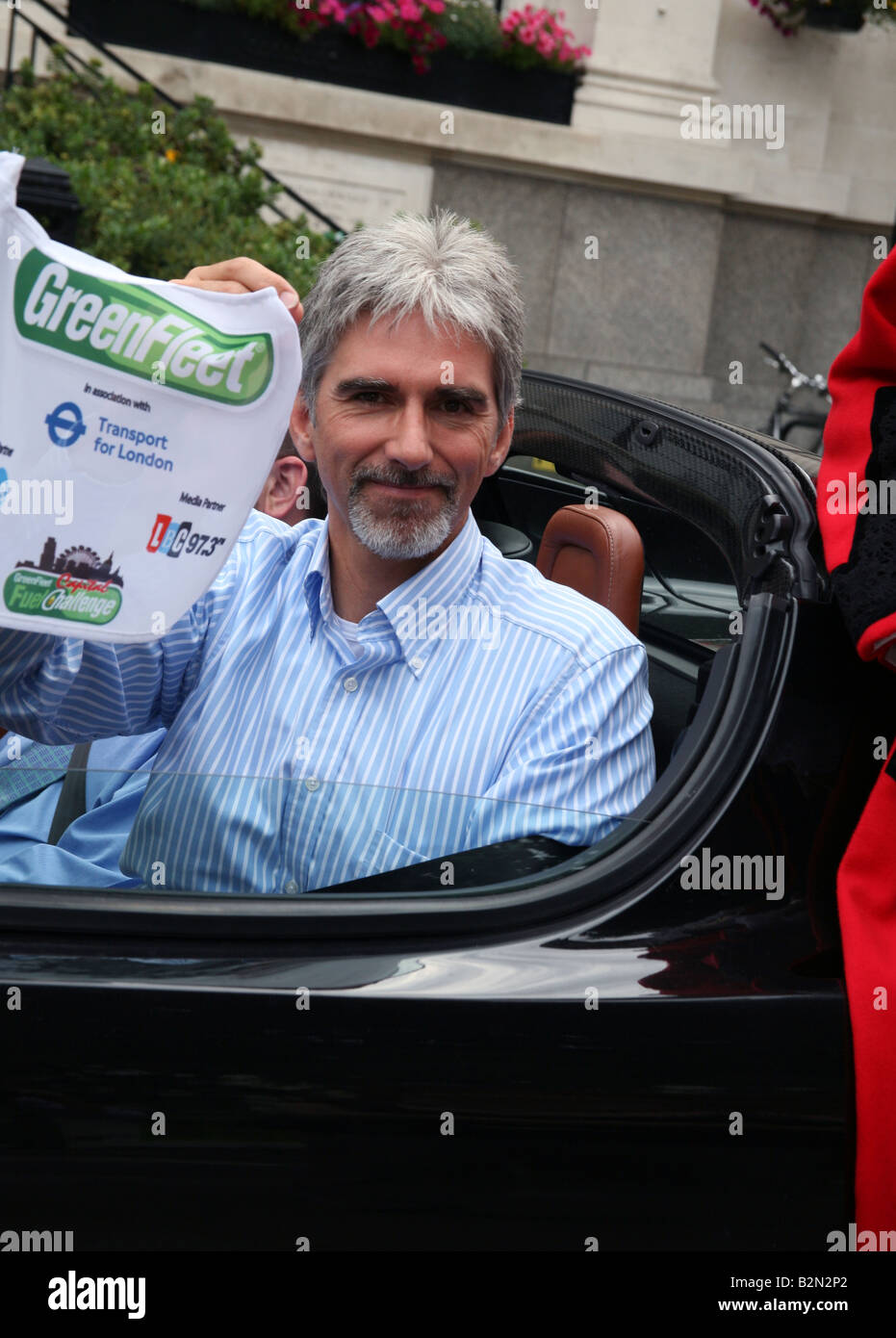 Damon Hill at wheel of Tesla electric sports car London Stock Photo