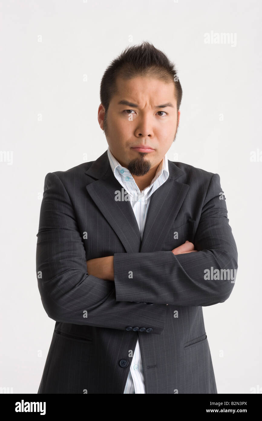 Portrait of a businessman standing with his arms crossed Stock Photo ...