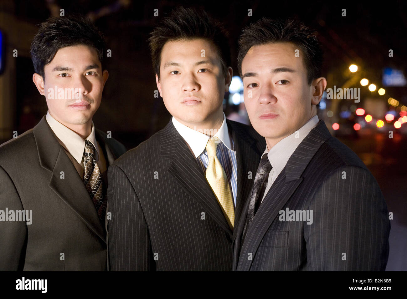 Portrait of businessmen standing in a row Stock Photo - Alamy