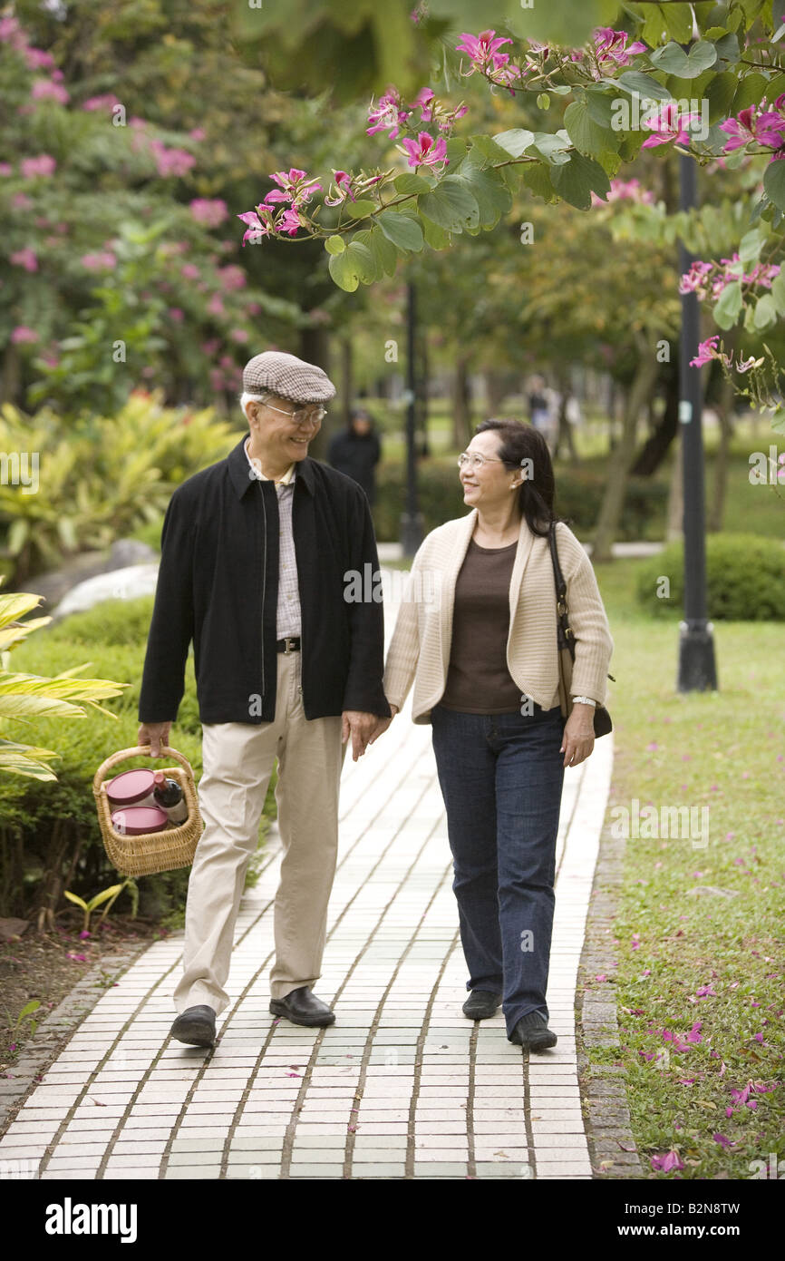 Happy senior chinese couple walking hi-res stock photography and images ...