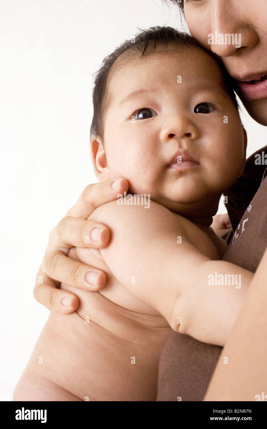 White woman holding black baby hi-res stock photography and images - Alamy