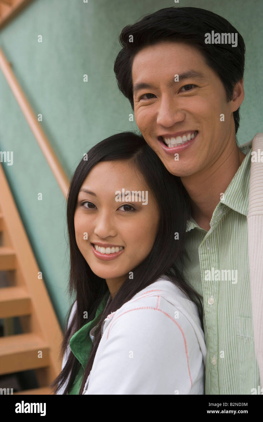 Portrait of a mid adult man and a young woman smiling Stock Photo