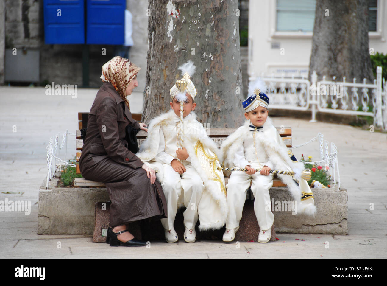 family beside the Blue Mosque, Istanbul. The boys are in traditional dress worn at time of their circumcision Stock Photo