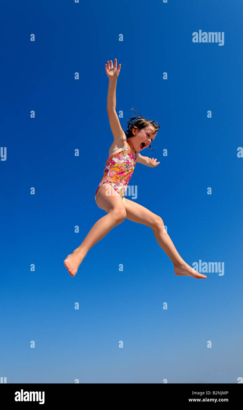 Joyful girl jumping. Stock Photo