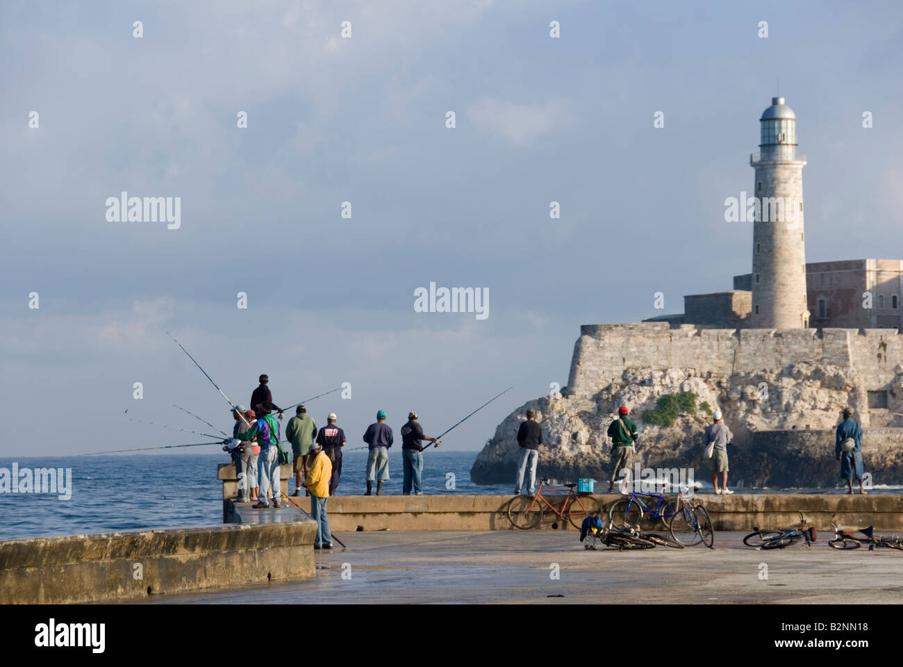 Men fishing opposite the Lighthouse at Morro Castle Havana Cuba Stock Photo