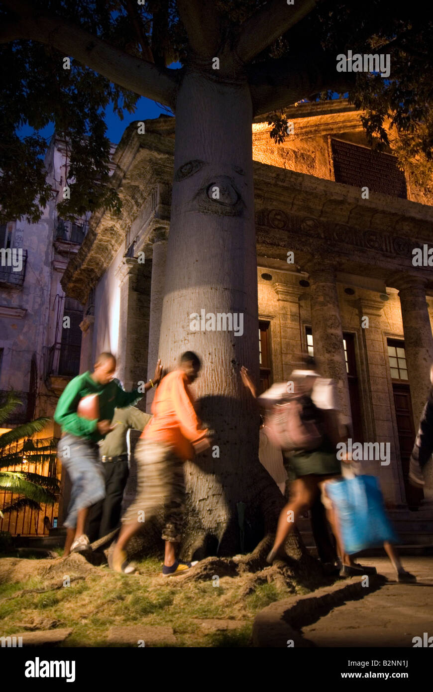 Cubans celebrate anniversary of first mass and town council of Havana by walking around the famous tree of El Templete the Doric Stock Photo