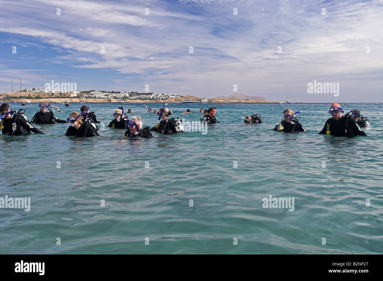 Group of Experience Scuba divers ready for first dive Naama Bay Sharm el Sheikh Sinai Egypt December sun Stock Photo