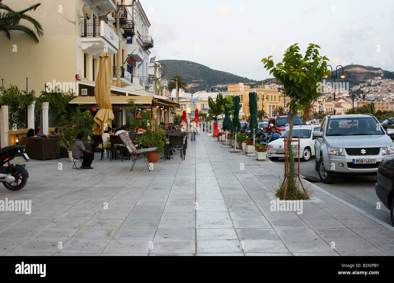 Street scene in Samos town centre in Greece where cafes line the street Stock Photo