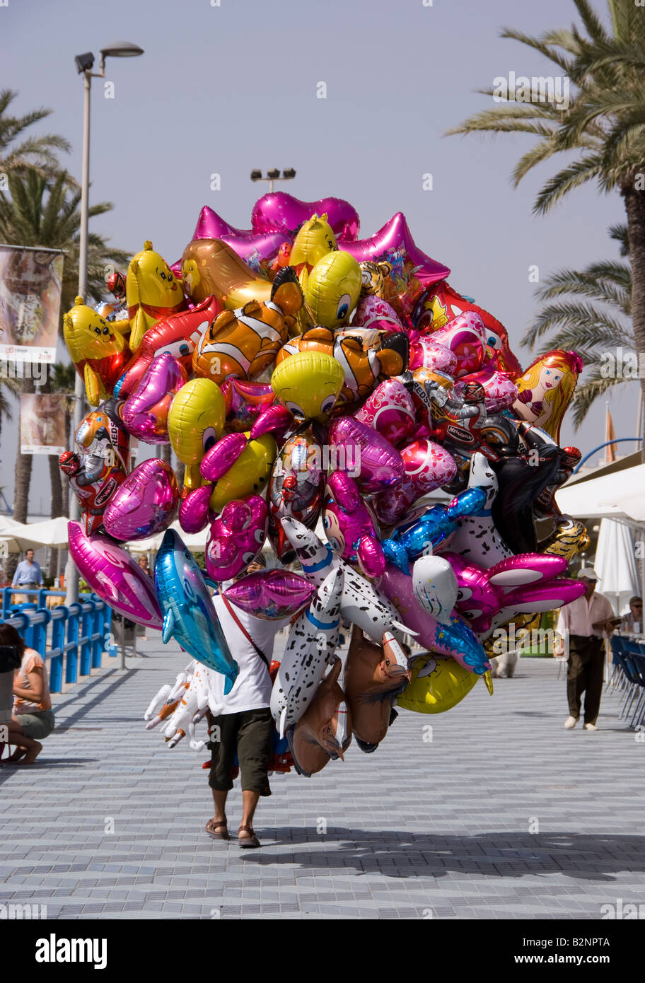 Street seller selling childrens helium balloons Stock Photo - Alamy