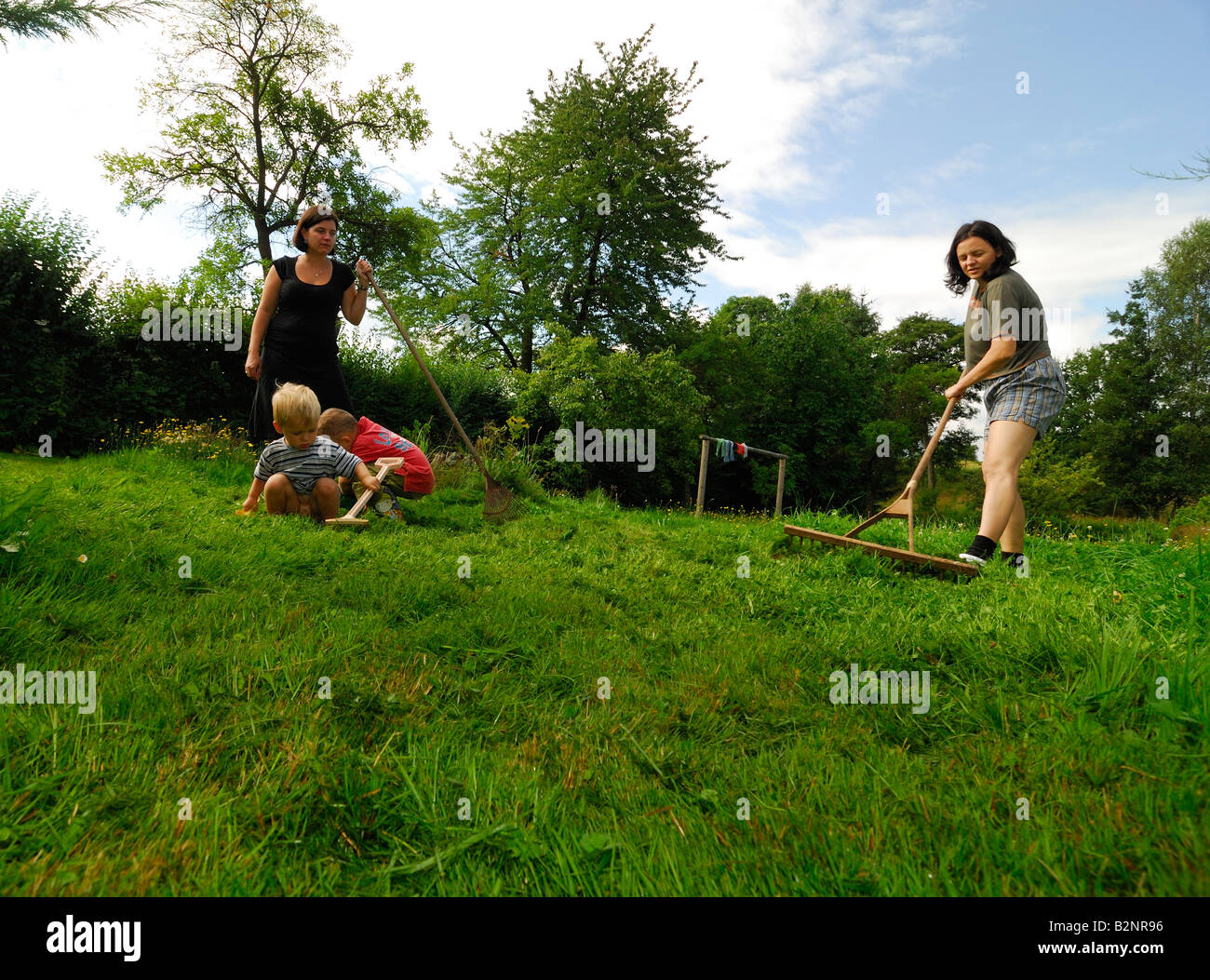 Kids children rake hi-res stock photography and images - Alamy