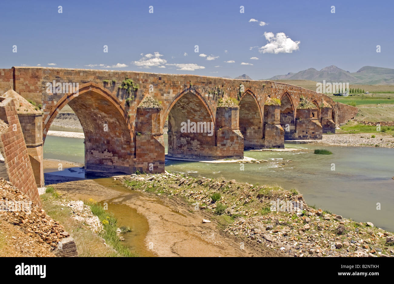 13th Century Ottoman Cobandede Bridge over Aras River between Pasinler and Horasan Stock Photo