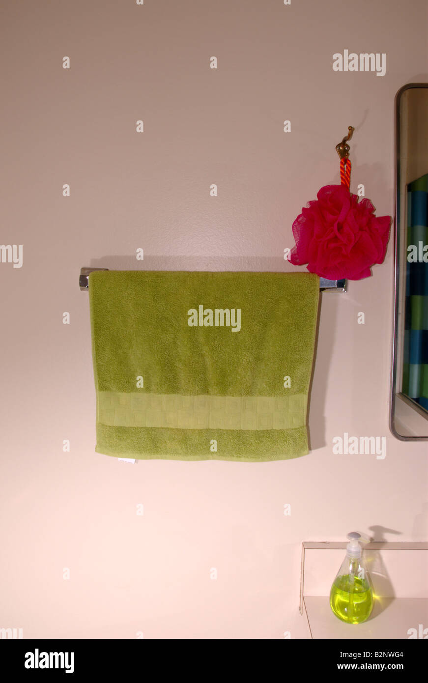 Bathroom hand towel and pink scrub Stock Photo