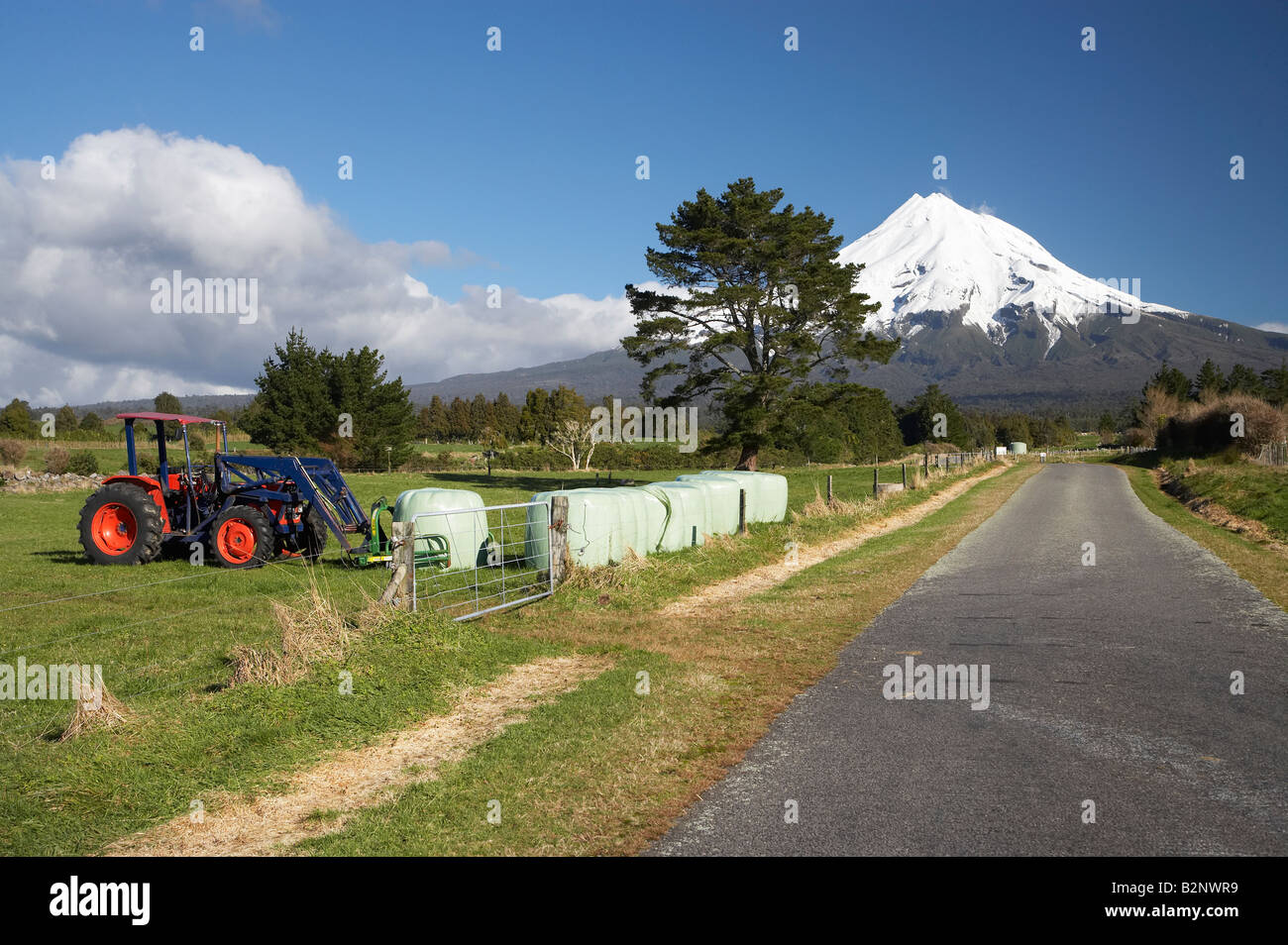 Tractor Hay Bales Road and Mt Taranaki Mt Egmont Taranaki North Island