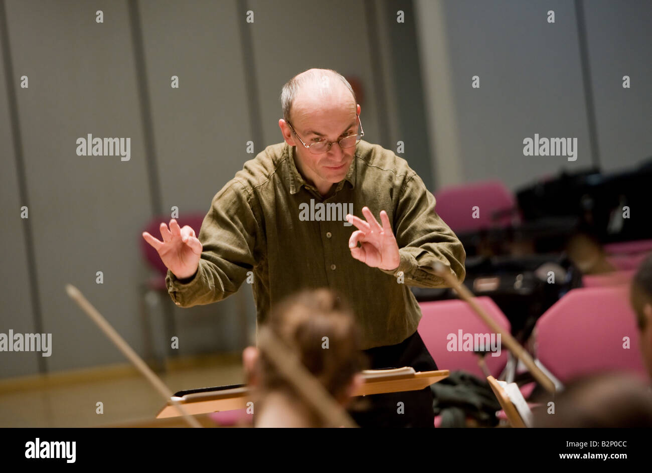 The conductor Professor Ruediger Bohn at work. Stock Photo