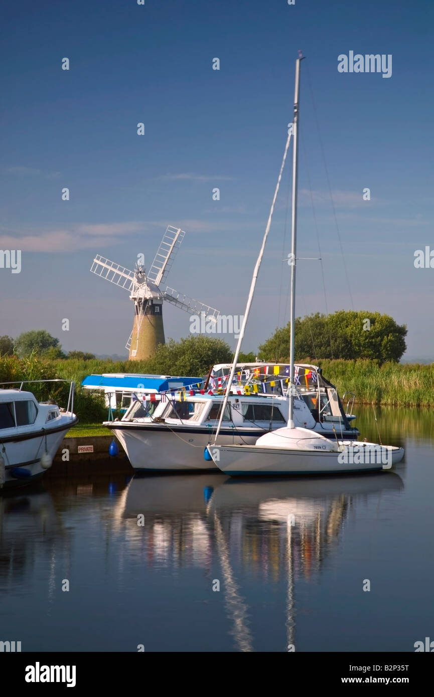 Sailing boats and yachts in the Norfolk Broads, UK, at the Thurne Mill mooring Stock Photo