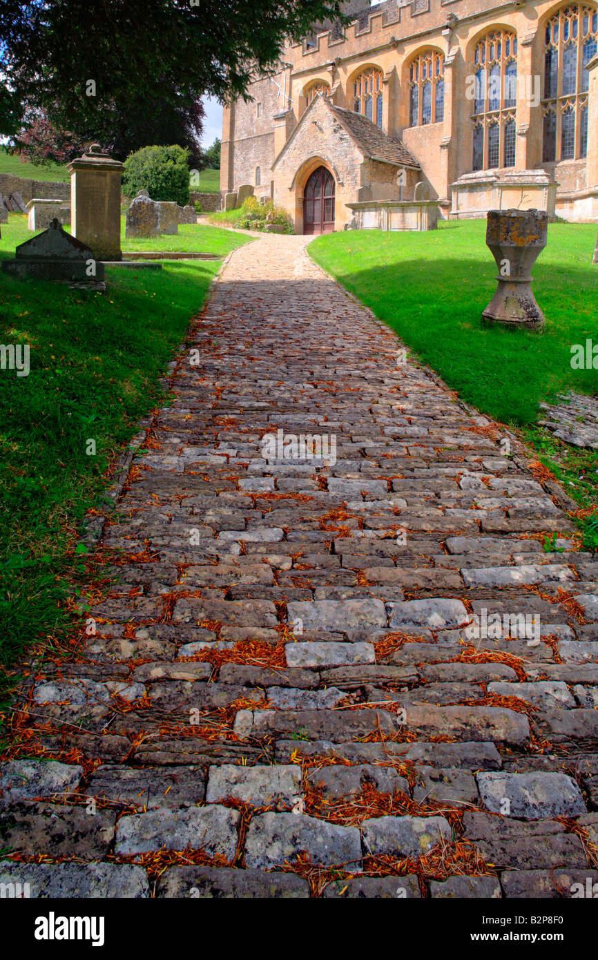 Cobbled Footpath to Parish Church Chedworth Gloucestershire Cotswolds England UK Stock Photo