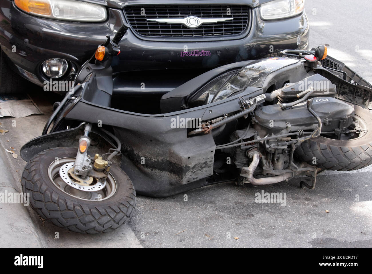 Miami Beach Florida,Washington Avenue,scooter,motorcycle,tip over,fall on pavement,damage,parked,auto,car,accident,FL080513013 Stock Photo