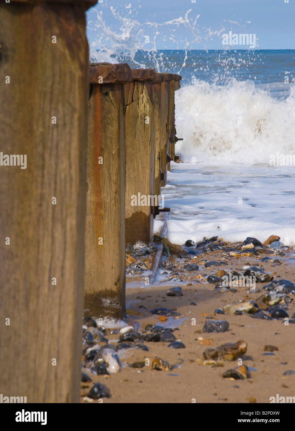 Waves break against breakwater Stock Photo Alamy