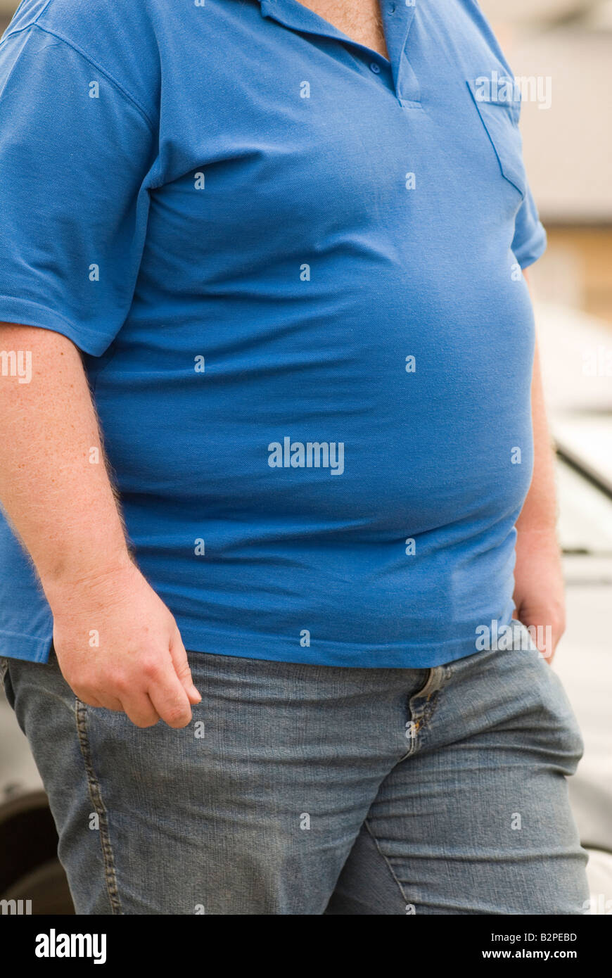 Ordinary middle aged fat man UK wear blue polo shirt HOMER SYKES Stock