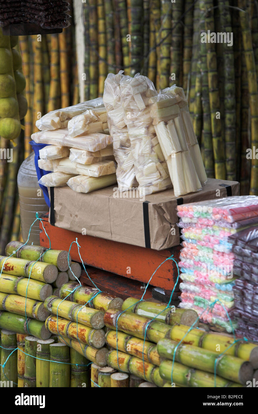 Raw sugar cane sticks and other sweets on sale in the town of