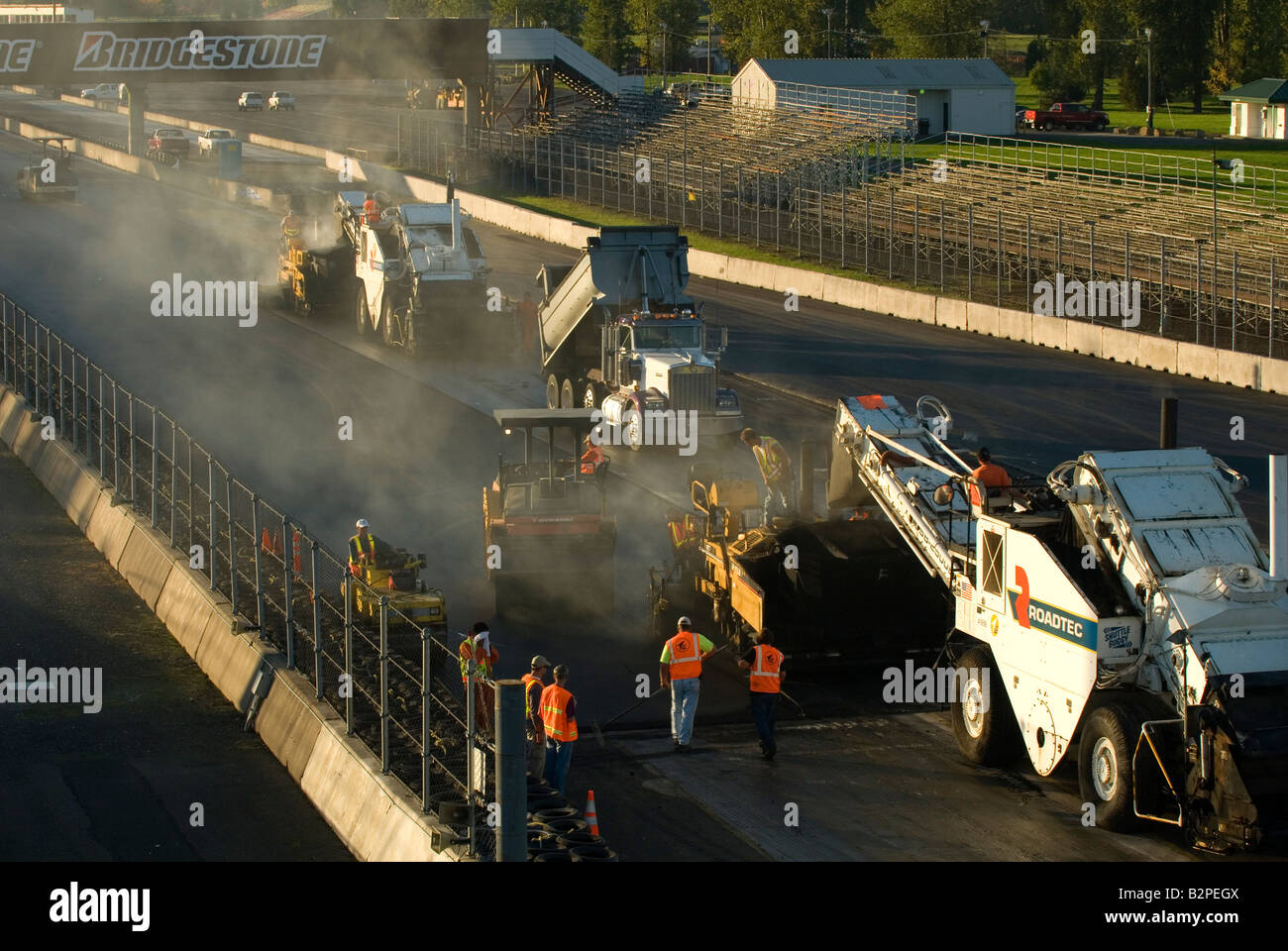 Asphalt paving machines working in echelon formation during the
