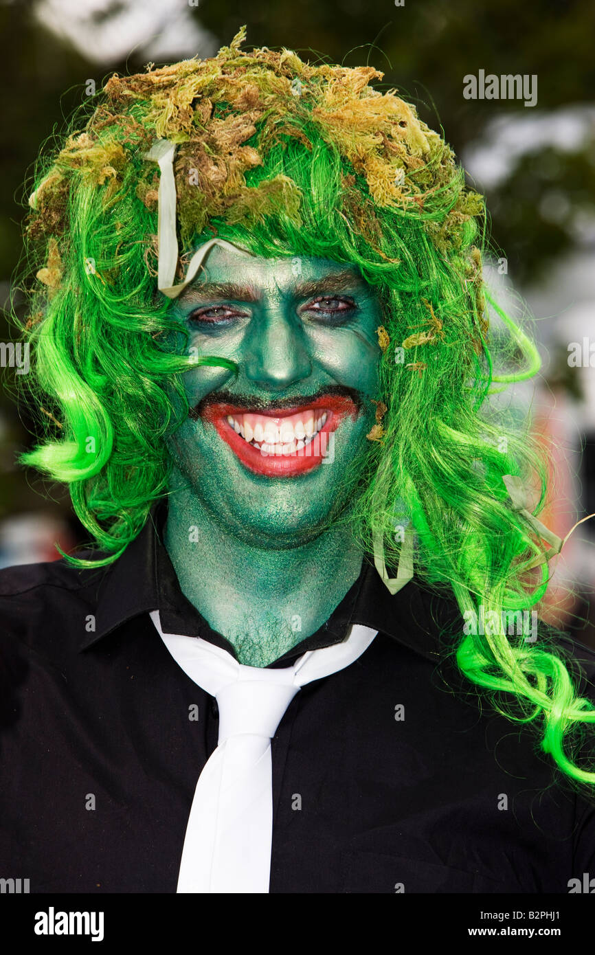 Man with crazy green face paint, big red lips & a green wig at The Big  Chill Festival 2008, Eastnor, Hereford Stock Photo - Alamy