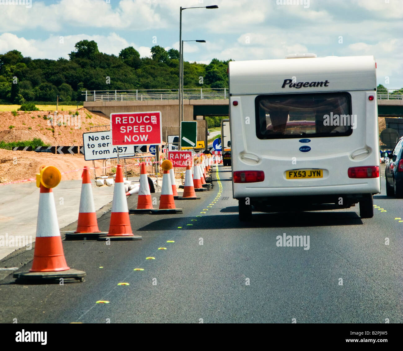 Traffic jam - Holiday caravan traffic jam and road works on UK motorway road Stock Photo