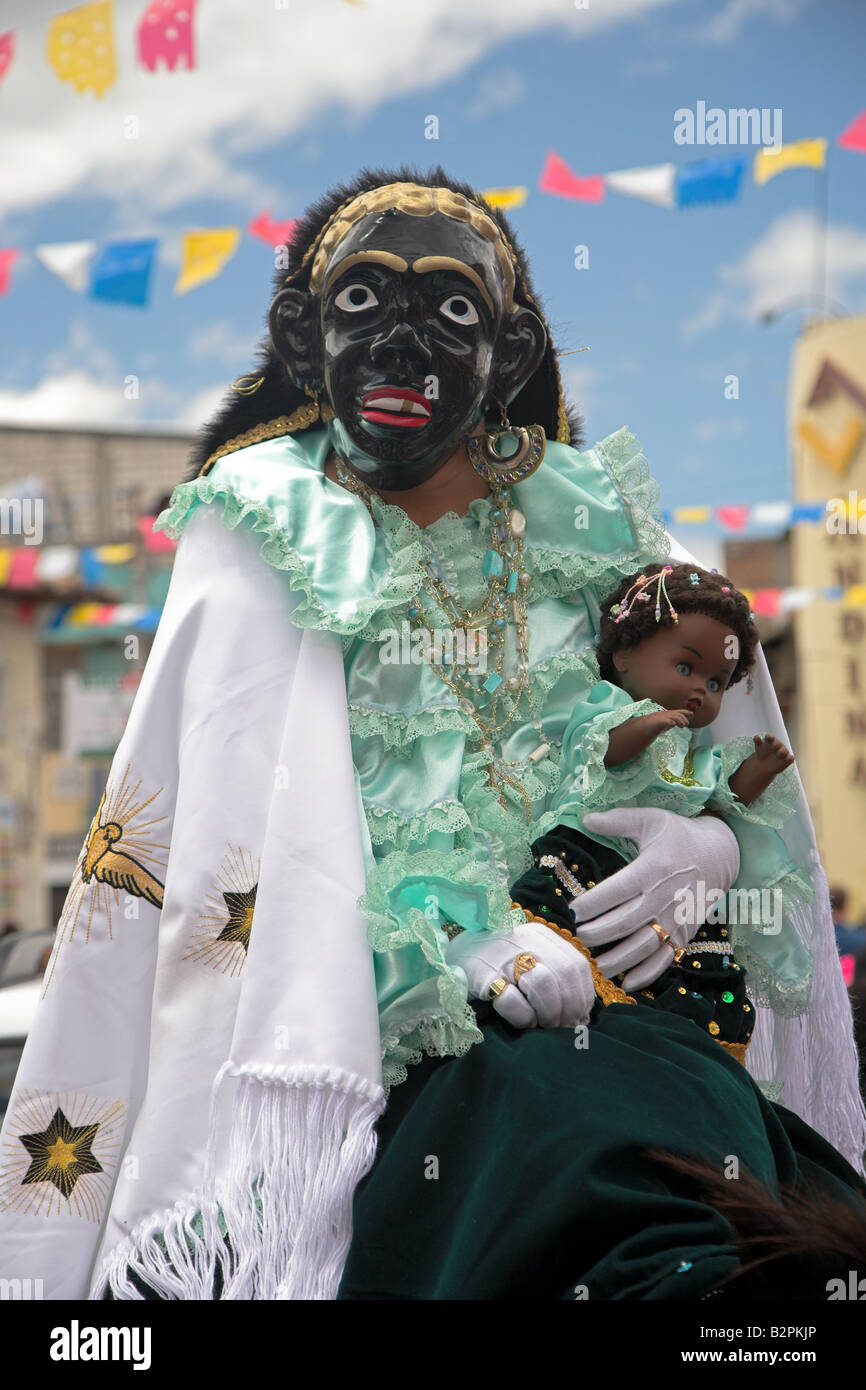 The Mama Negra Riding Through The Street For The Annual Mama Negra the-mama-negra-riding-through-the-street-for-the-annual-mama-negra