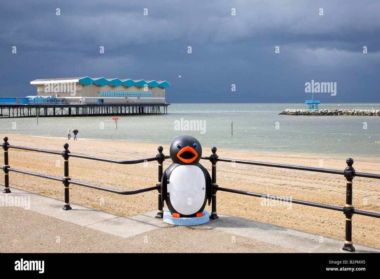 Novelty penguin litter bin on the sea front promenade in Herne Bay Kent