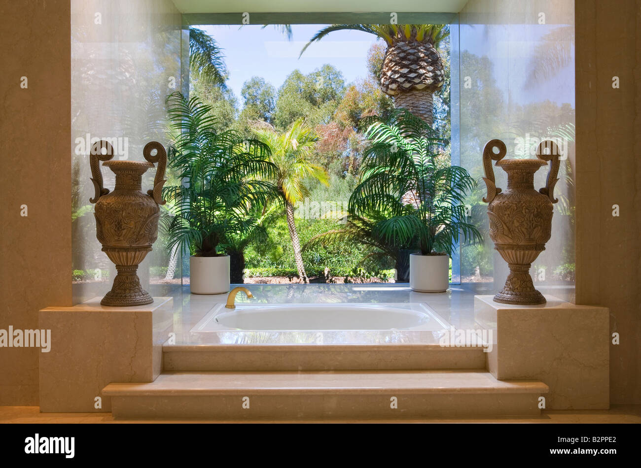 Marble steps leading to an elegant Jacuzzi bathtub Stock Photo