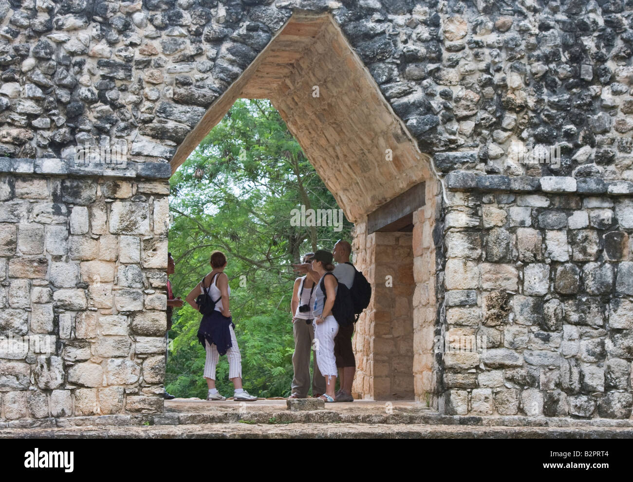 Group Of Tourists Under Famous Mayan Corbel Arch At Ek Balam Ek
