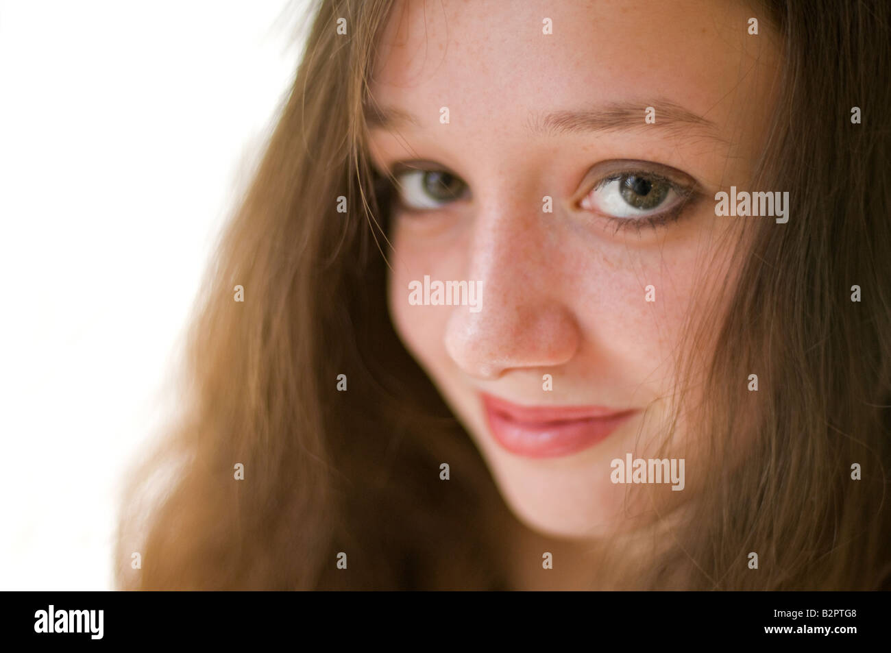 An attractive chestnut brown haired adolescent Caucasian girl Shot with minimum depth of field Focus is on the eye Stock Photo