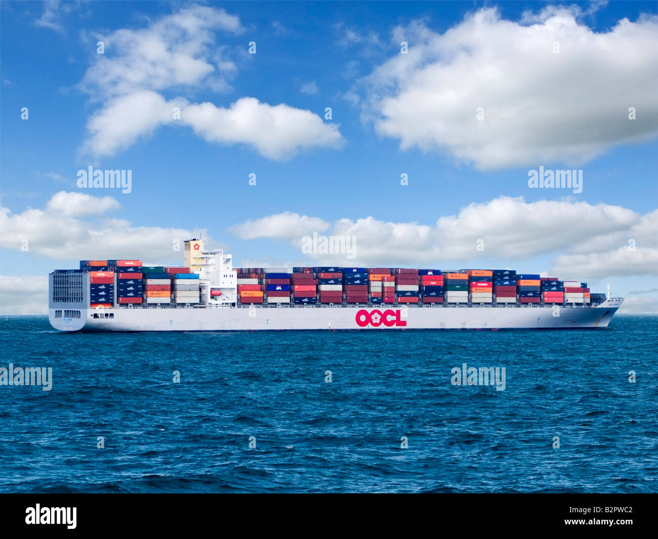 Container ship or cargo ship loaded with shipping containers sailing at sea ocean mid English Channel UK Stock Photo