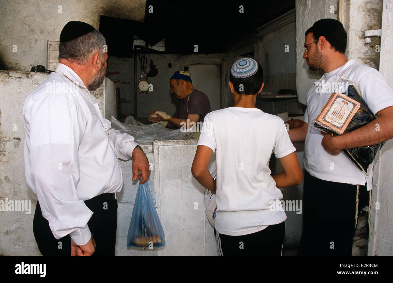Male customers waiting at jewish bakery shop counter, Israel, Middle East Stock Photo Alamy