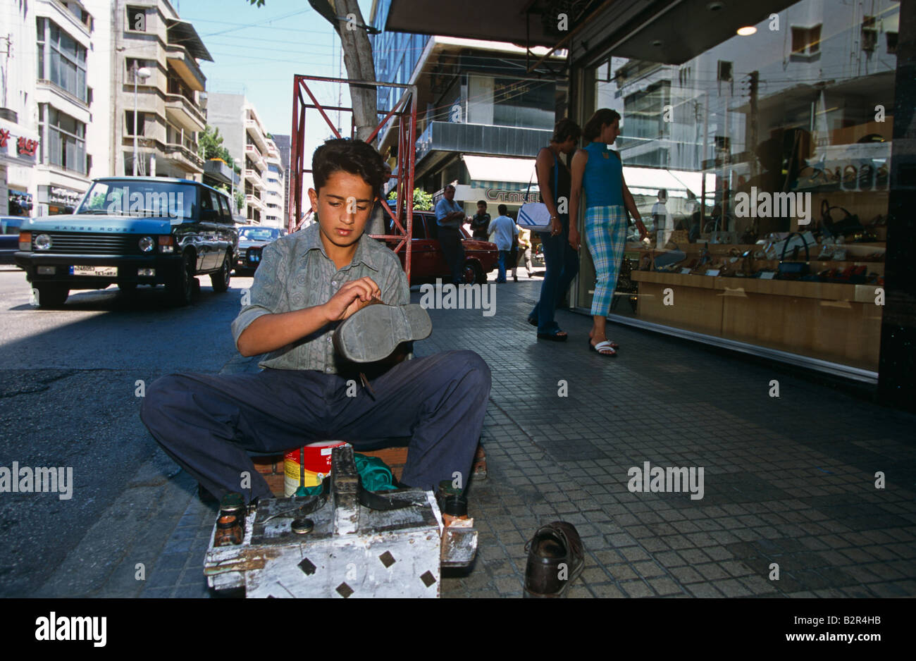 Shoe polish boy on the sidewalk in Beirut, Lebanon Stock Photo Alamy