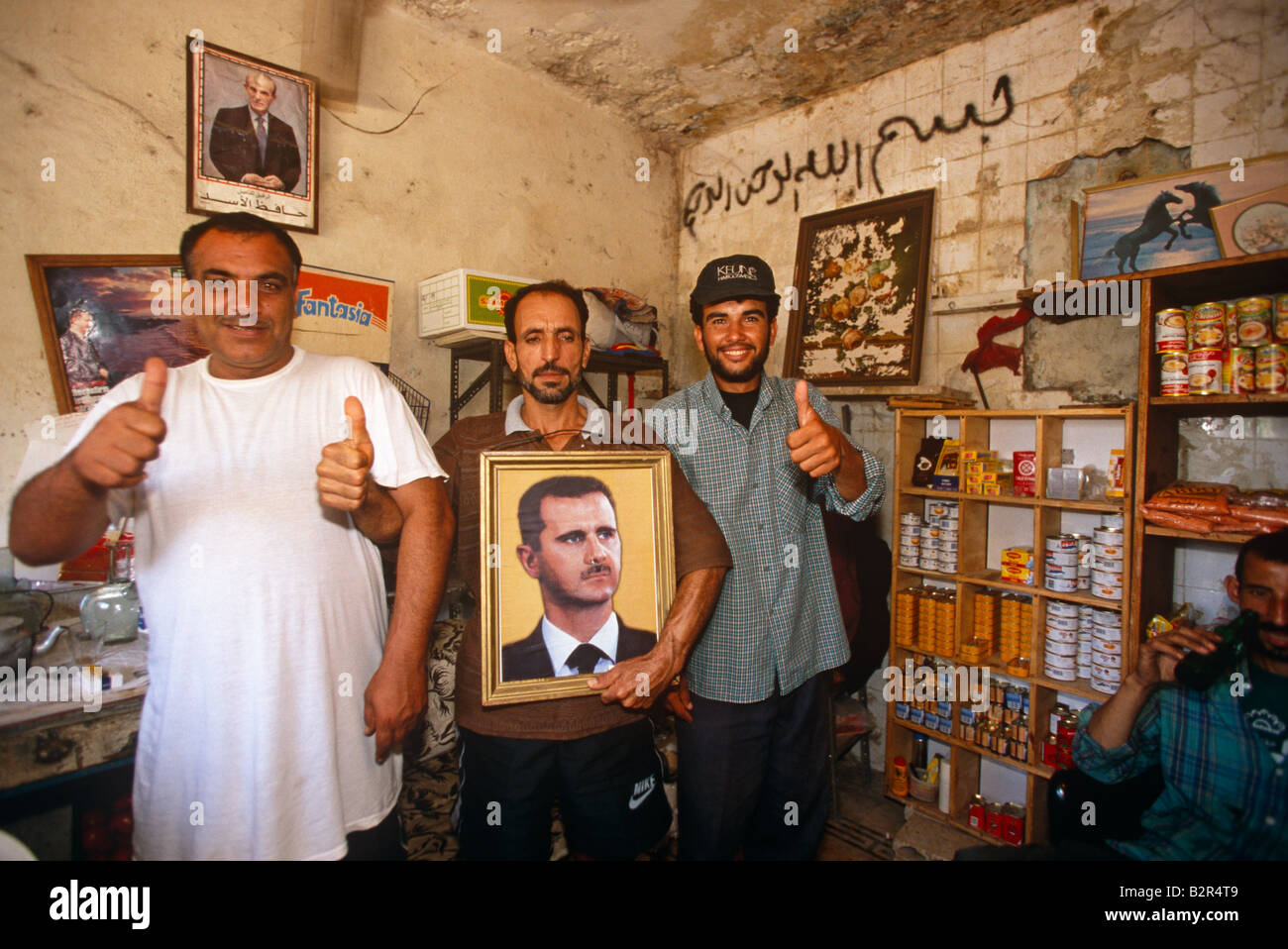 Men with a portrait of Syrian President Bashar al-Assad in Beirut, Lebanon. Stock Photo