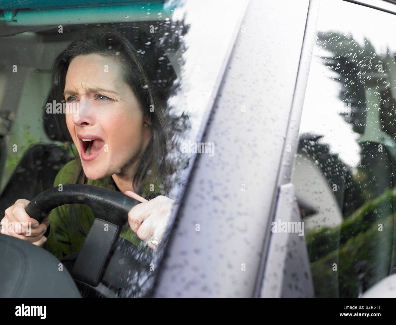 Restive woman driving Stock Photo