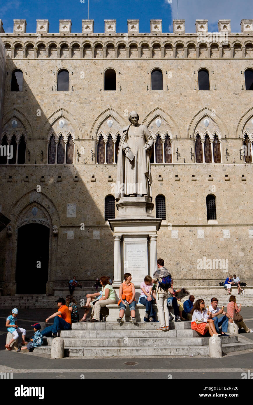The medieval town in the centre of the Tuscany Monument of the Sallustio Bandini in front of the Palazzo Salimbeni Stock Photo