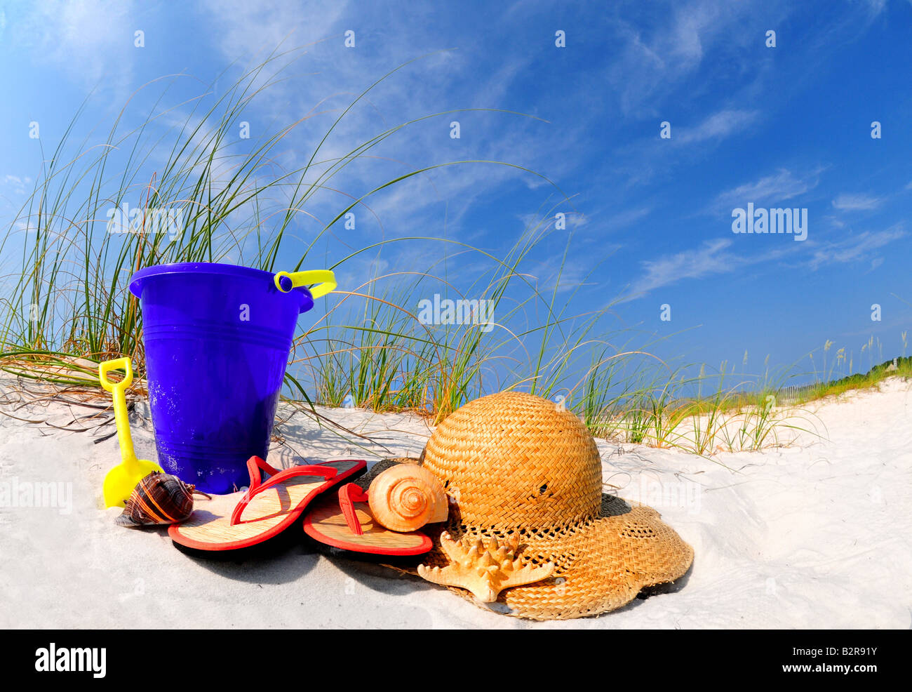 Beach supplies on pretty sand dune Stock Photo Alamy