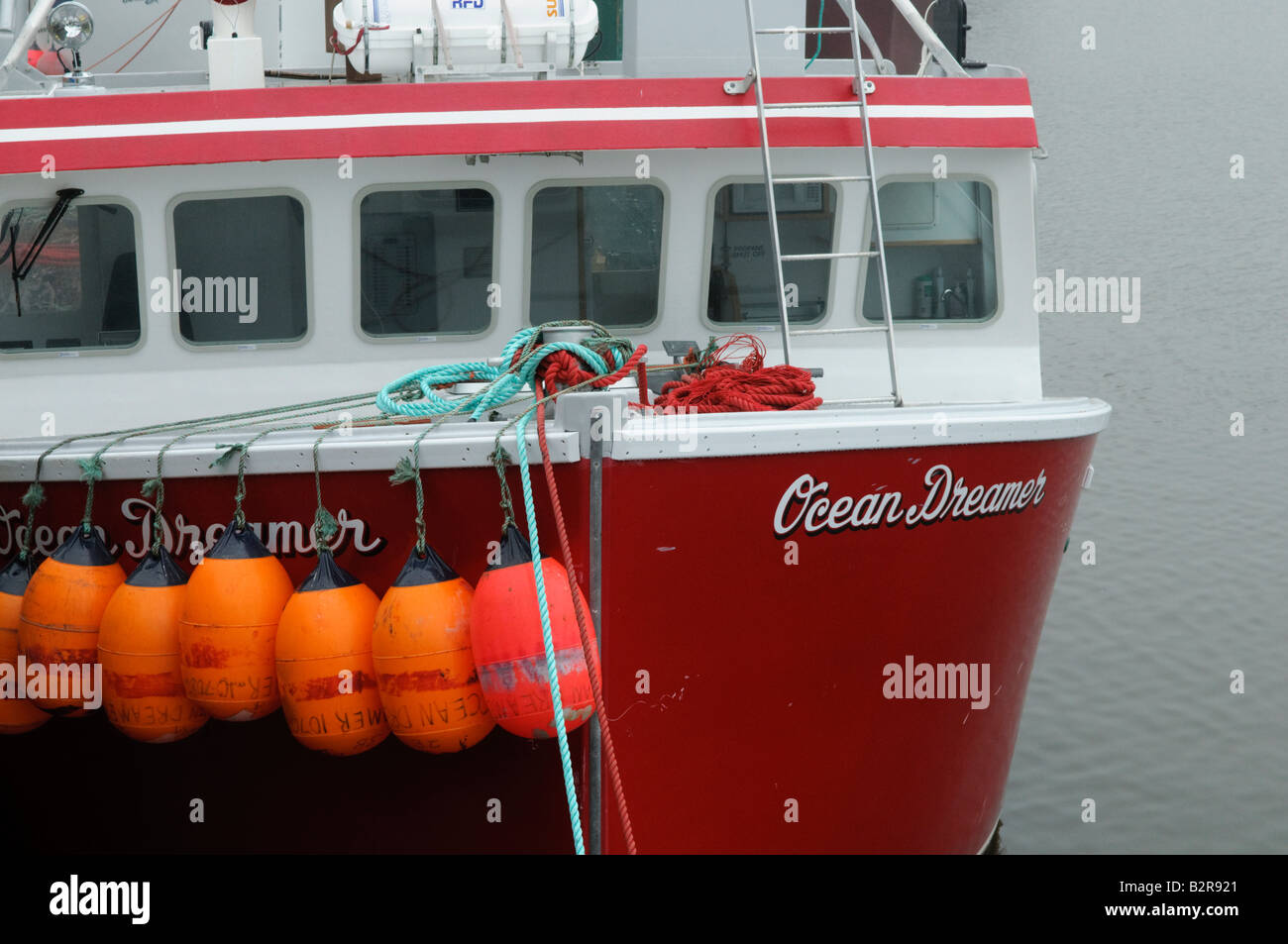 Lobster fishing boats and traps at dock in the Port of Saint John on a