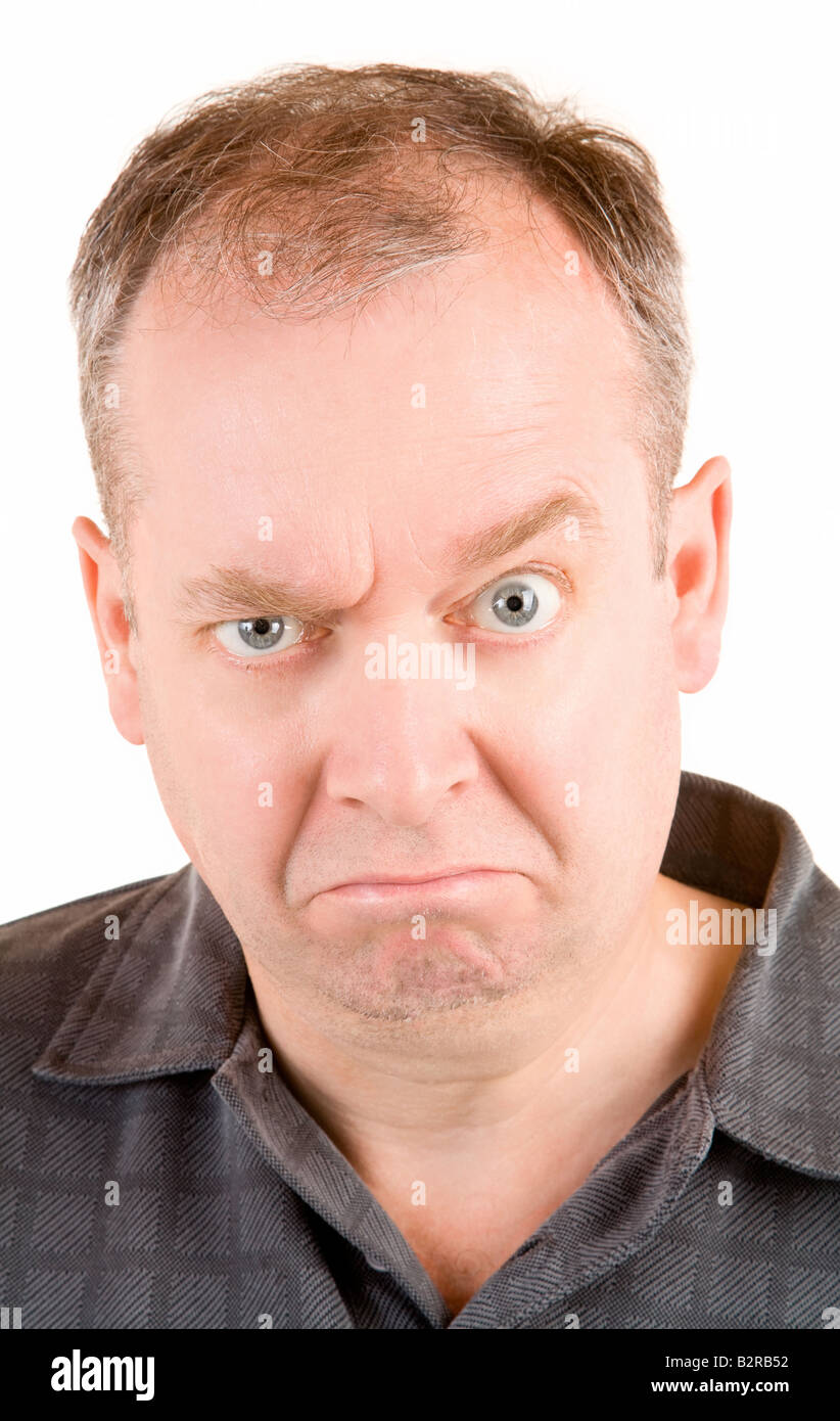 This is a portrait of a grumpy middle aged man Stock Photo