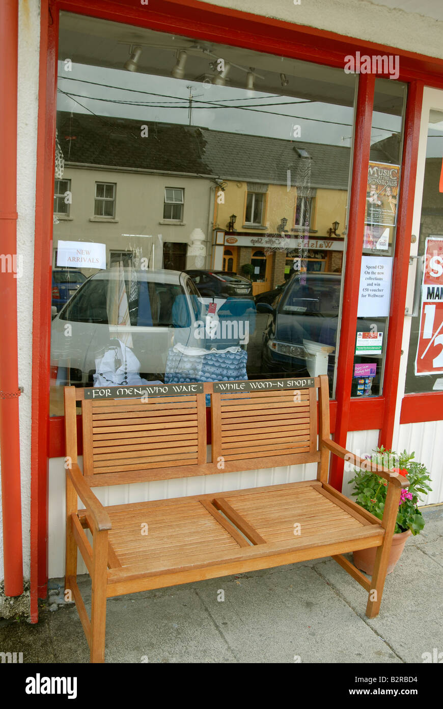 Bench in front of a shop in Clifden labeled