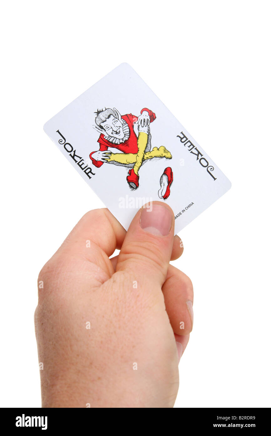 hand holding jokers card Stock Photo