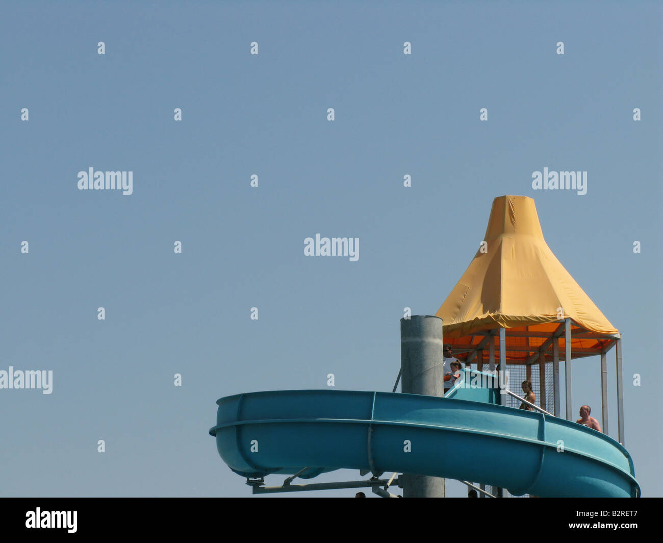 water slide against expanse of blue sky Stock Photo