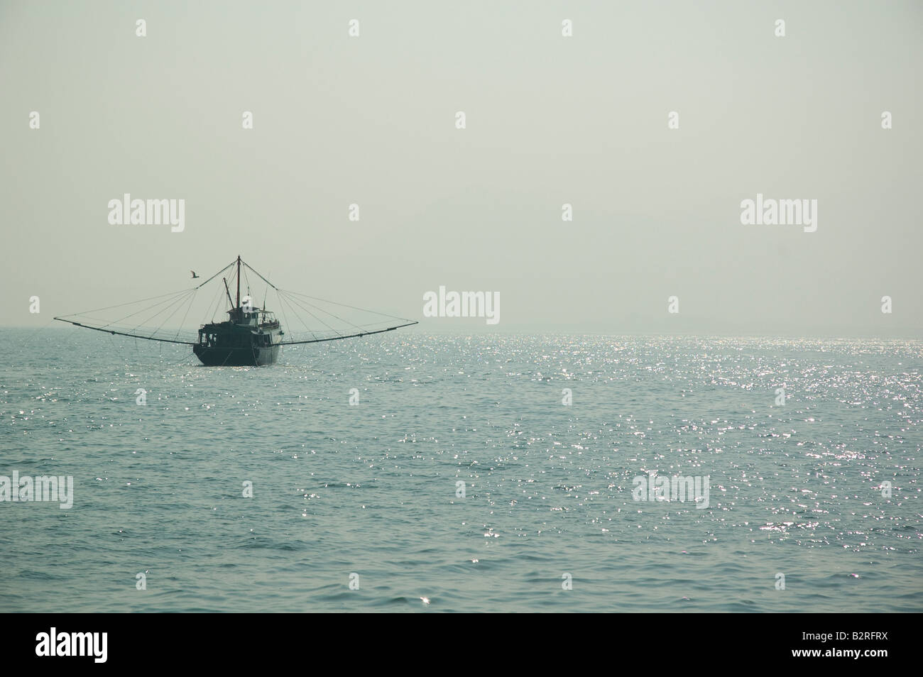Trawler heading out, Hong Kong Stock Photo