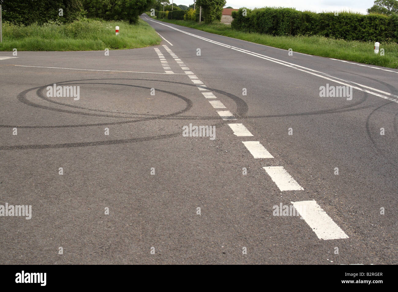 January 2008 - Skid marks on a quiet rural road left by bored teenage drivers Stock Photo