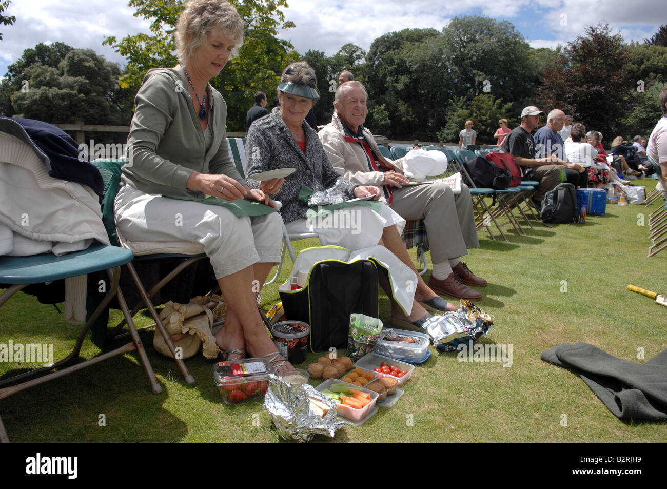 Spectators enjoy a picnic at a Sussex cricket match in Arundel Sussex UK Stock Photo
