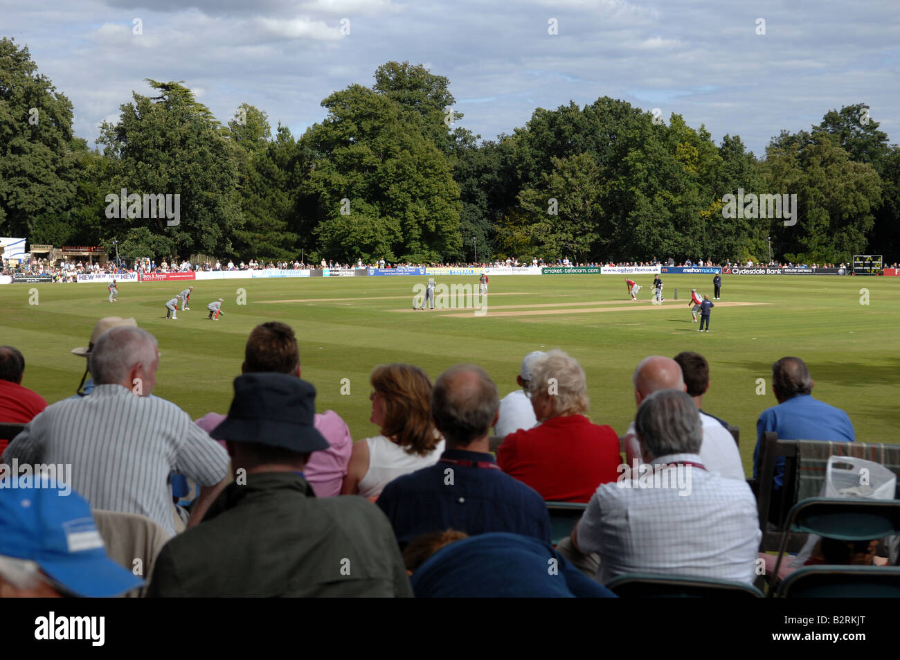 Spectators watch a cricket match between Sussex and Somerset at the Arundel Castle ground UK Stock Photo