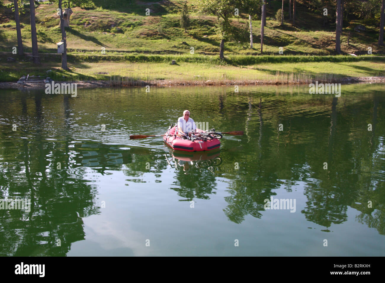 Rowing an inflatable dinghy Stock Photo Alamy