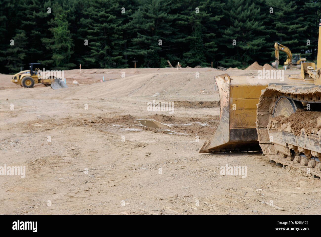 Bulldozer at clearing for new housing development Stock Photo